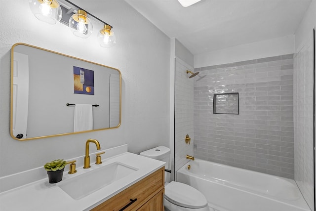 full bathroom with vanity, toilet, and tiled shower / bath