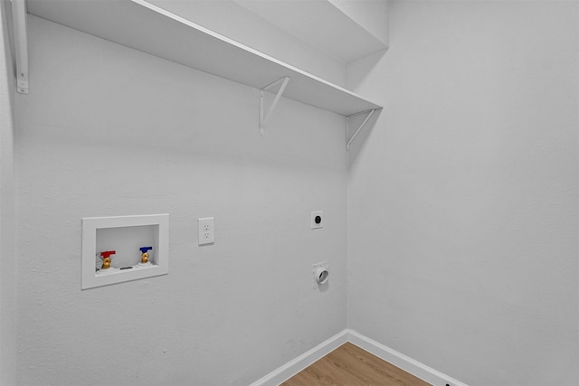 laundry room with hardwood / wood-style floors, hookup for an electric dryer, and hookup for a washing machine