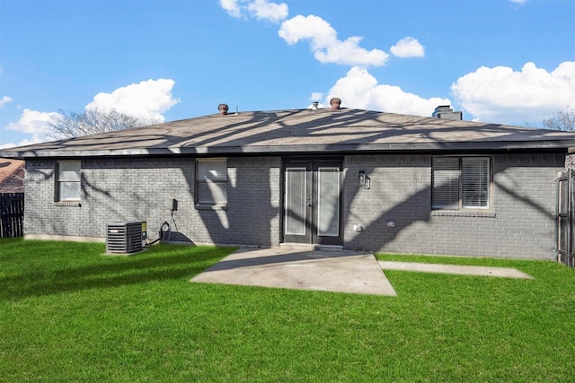 back of house featuring a lawn, a patio area, and central AC unit