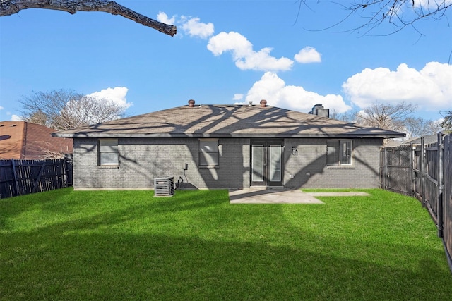 back of property featuring a patio area and a lawn