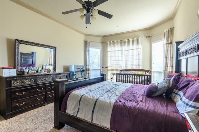 bedroom featuring crown molding, ceiling fan, and carpet flooring