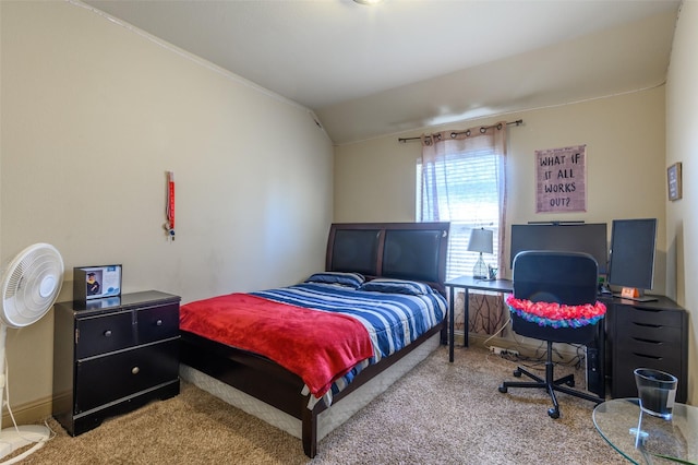 bedroom with carpet flooring and vaulted ceiling