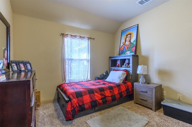 bedroom featuring vaulted ceiling and light carpet