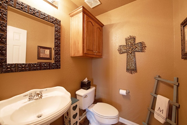 bathroom with sink and toilet