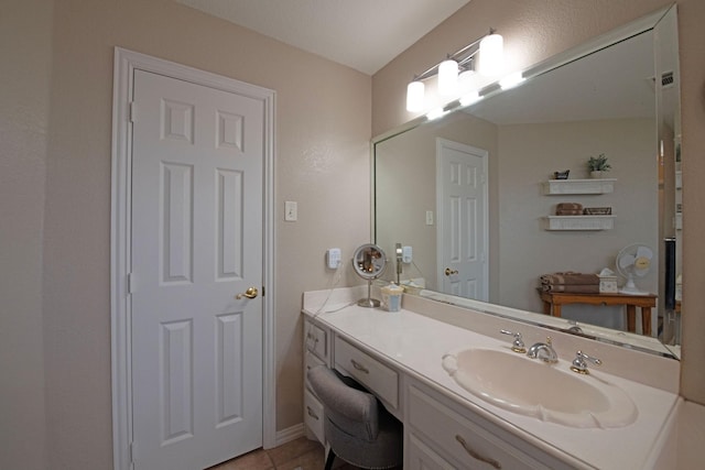 bathroom with vanity and tile patterned flooring