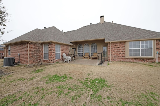 back of house with central AC and a patio