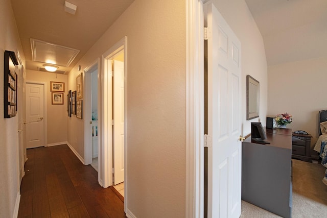 hallway with dark hardwood / wood-style flooring