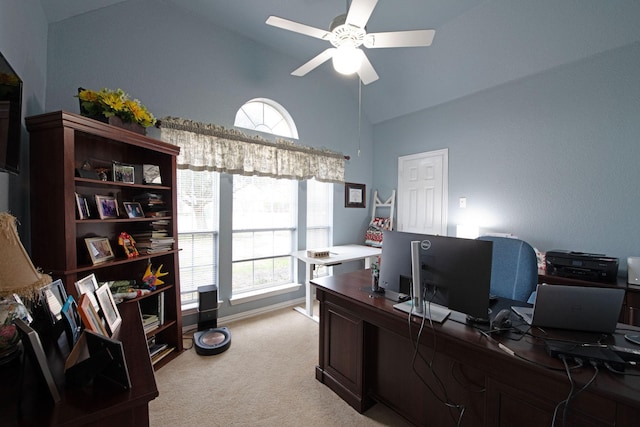 home office with lofted ceiling, light carpet, and ceiling fan