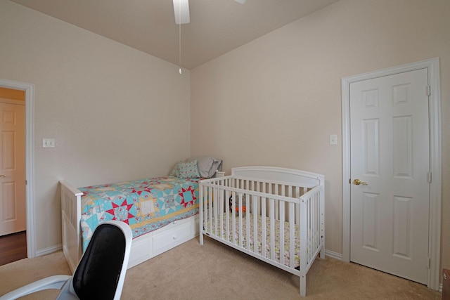 carpeted bedroom featuring ceiling fan