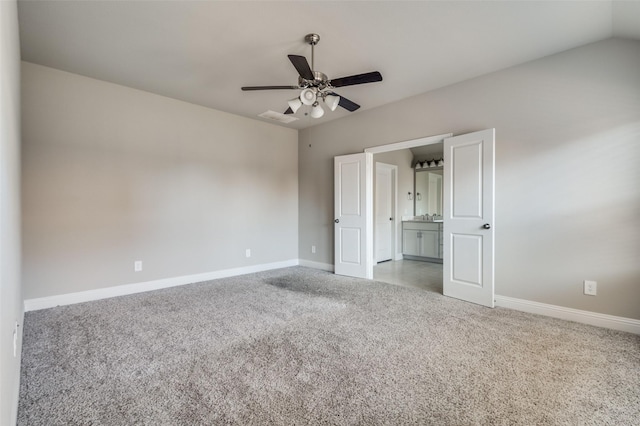 unfurnished bedroom with lofted ceiling, light colored carpet, and ceiling fan