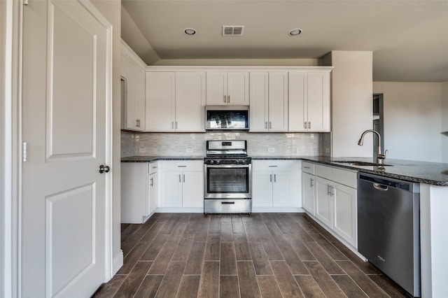 kitchen featuring white cabinetry, sink, and appliances with stainless steel finishes