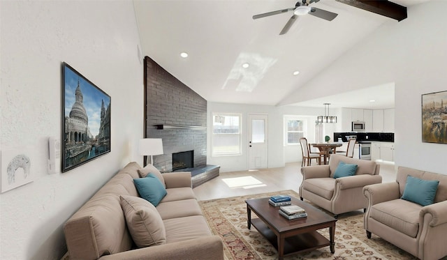 living room with light hardwood / wood-style flooring, ceiling fan, beam ceiling, high vaulted ceiling, and a fireplace