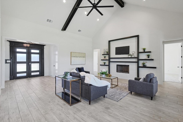 living room with beam ceiling, high vaulted ceiling, french doors, and ceiling fan