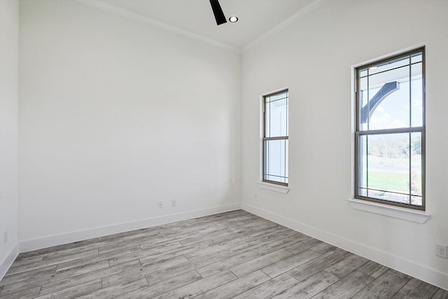 spare room featuring ornamental molding, light hardwood / wood-style floors, and ceiling fan