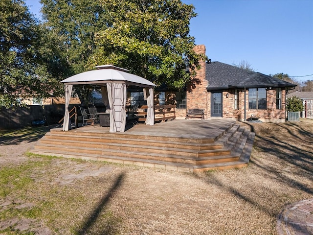 view of front of home featuring a gazebo, central AC unit, and a deck