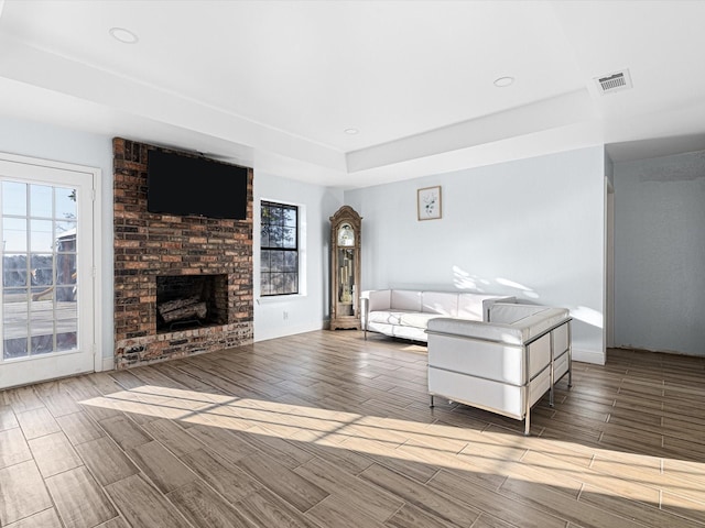 unfurnished living room with a brick fireplace