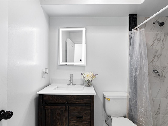 bathroom with vanity, toilet, and a shower with shower curtain