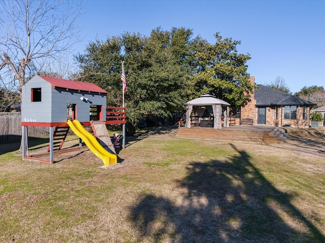 view of yard with a gazebo and a playground