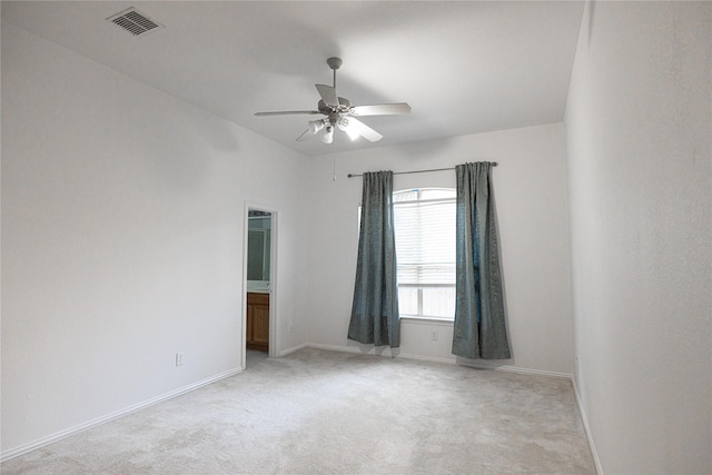 unfurnished room with ceiling fan and light colored carpet