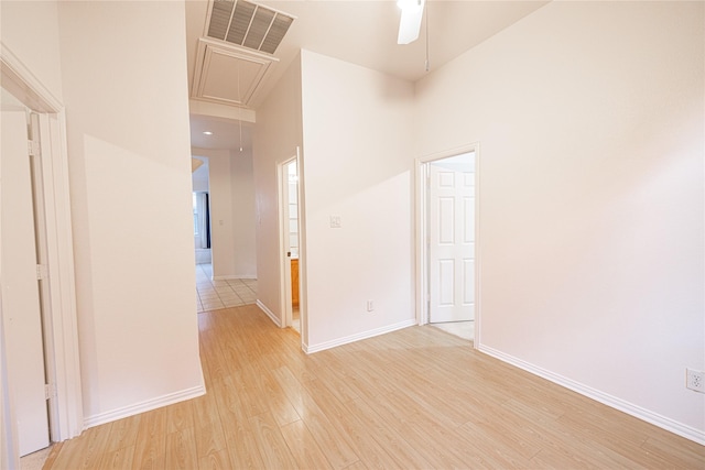 empty room featuring ceiling fan and light hardwood / wood-style floors