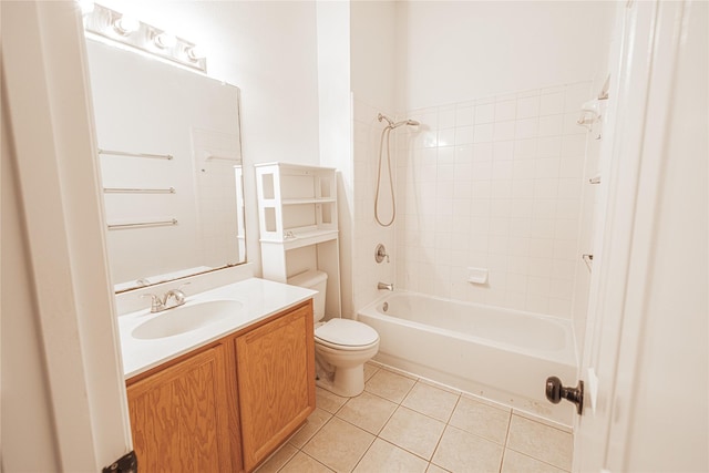 full bathroom featuring tile patterned floors, toilet, tiled shower / bath combo, and vanity