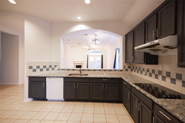 kitchen with light tile patterned flooring, dishwasher, sink, light stone counters, and black electric cooktop