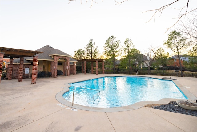 view of swimming pool featuring a patio area