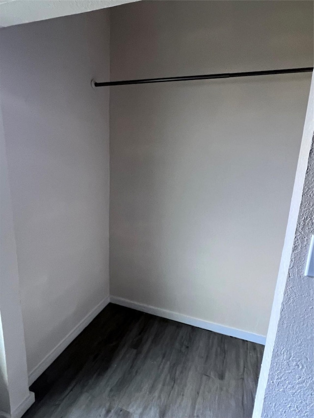 spare room with dark hardwood / wood-style flooring