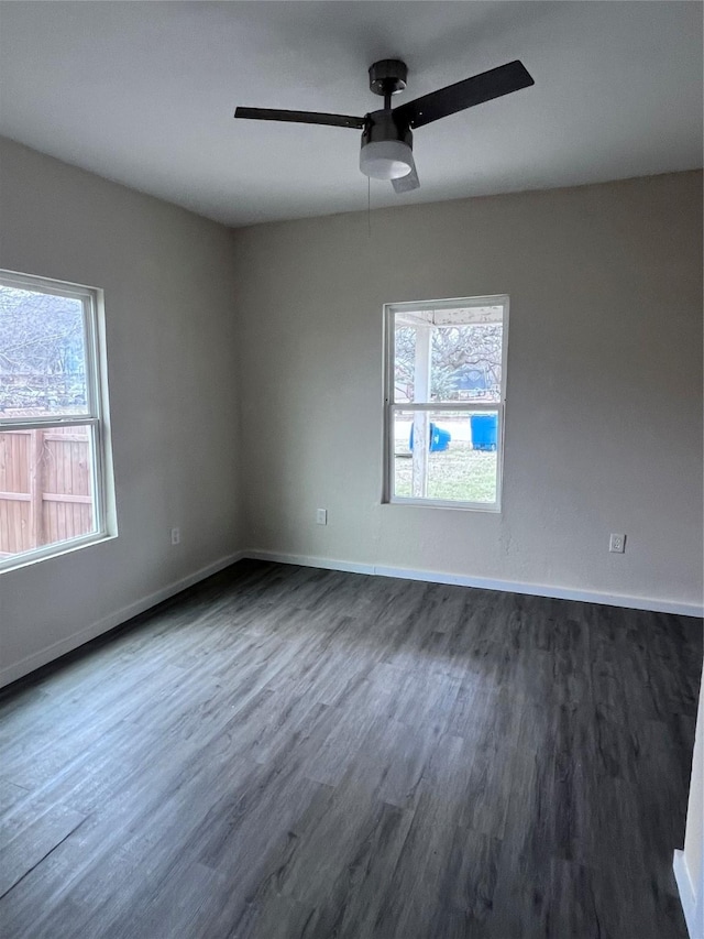 unfurnished room featuring dark hardwood / wood-style floors and ceiling fan