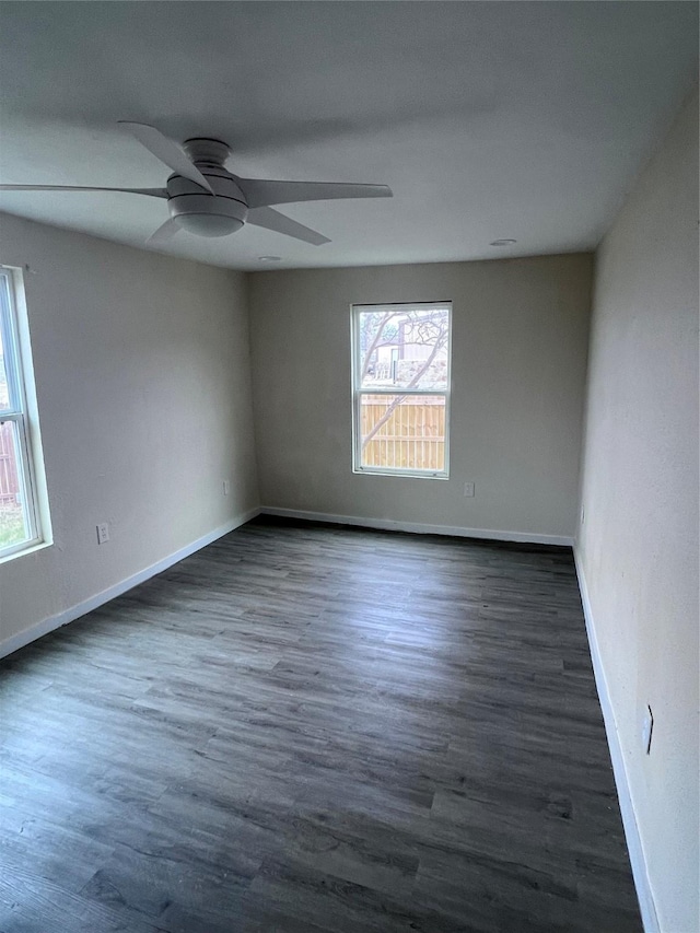 unfurnished room featuring ceiling fan and dark hardwood / wood-style floors