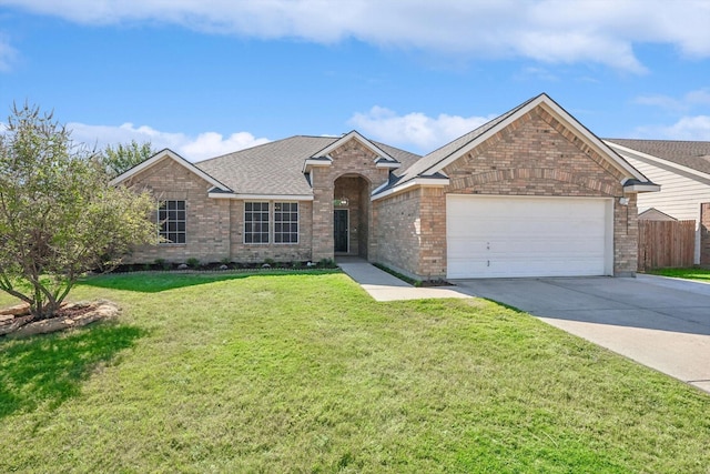 ranch-style house featuring brick siding, an attached garage, a front lawn, fence, and driveway