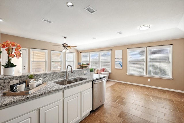 kitchen with visible vents, dishwasher, white cabinetry, and a sink