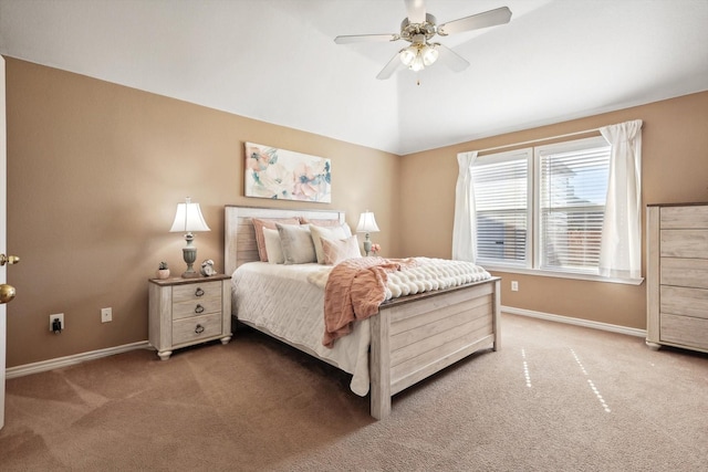 bedroom with baseboards, carpet floors, lofted ceiling, and ceiling fan