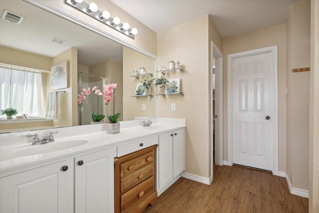 bathroom with wood-type flooring, shower with separate bathtub, and ceiling fan