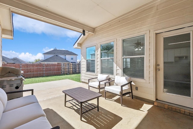 view of patio / terrace featuring grilling area, an outdoor hangout area, and fence