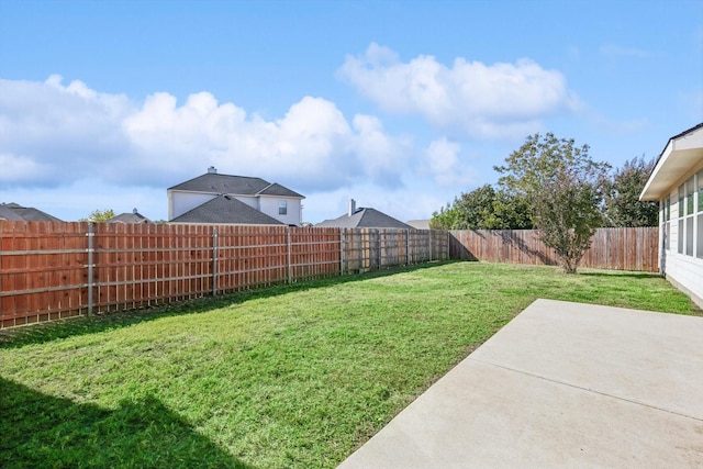 view of yard featuring a fenced backyard and a patio area