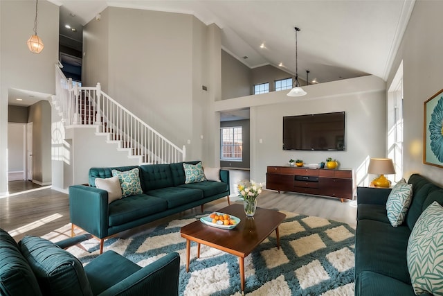 living room featuring light hardwood / wood-style flooring and high vaulted ceiling