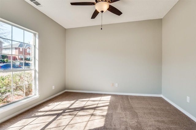 carpeted empty room with ceiling fan