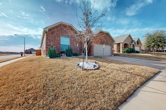 view of front facade with a garage and a front yard