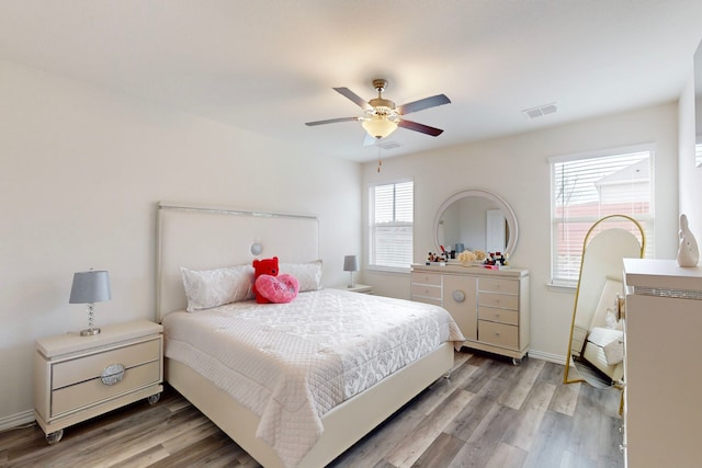 bedroom featuring wood-type flooring and ceiling fan