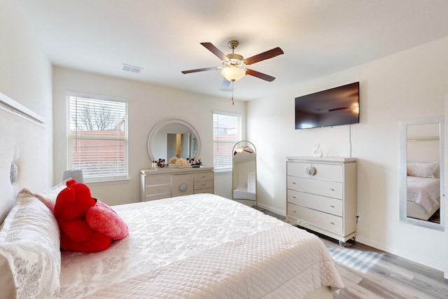 bedroom featuring ceiling fan and light hardwood / wood-style floors