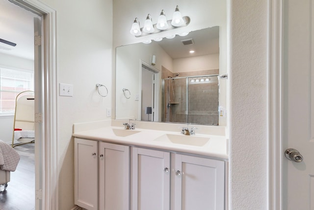 bathroom featuring vanity and walk in shower