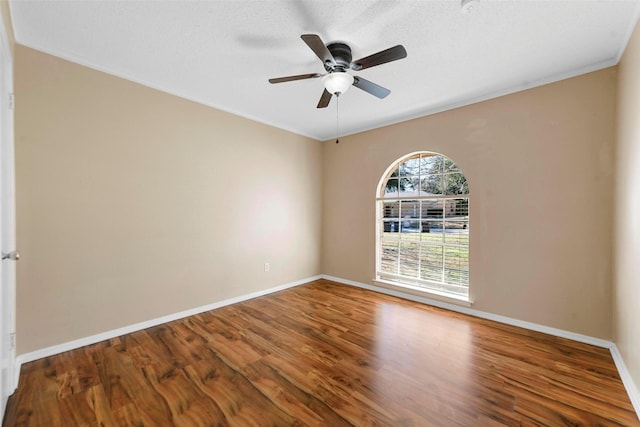 spare room with ceiling fan, hardwood / wood-style floors, and a textured ceiling