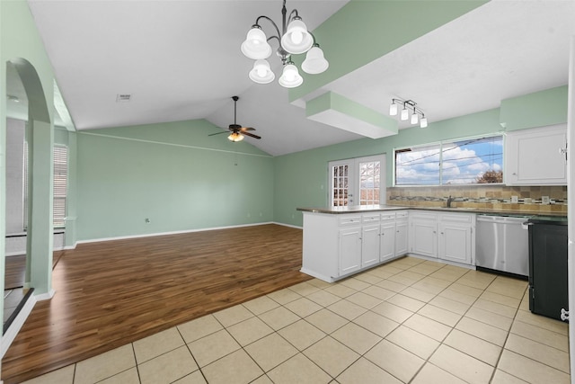 kitchen with light tile patterned flooring, decorative light fixtures, white cabinetry, dishwasher, and decorative backsplash