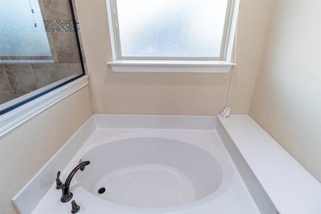 bathroom with a tub