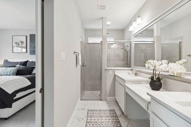 bathroom featuring vanity and a shower with door