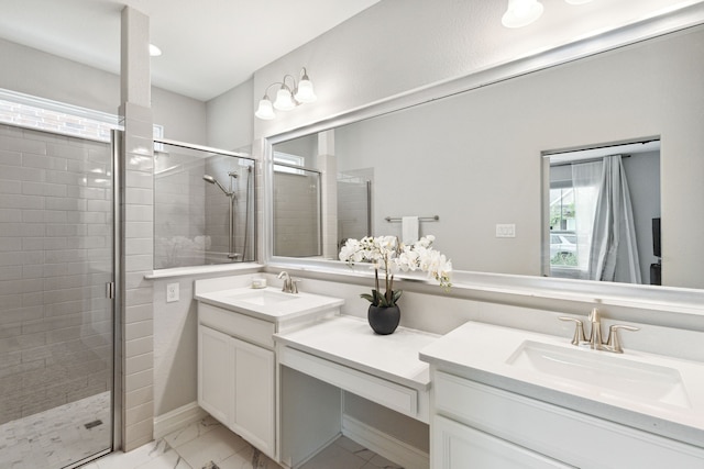 bathroom with a shower with door and vanity