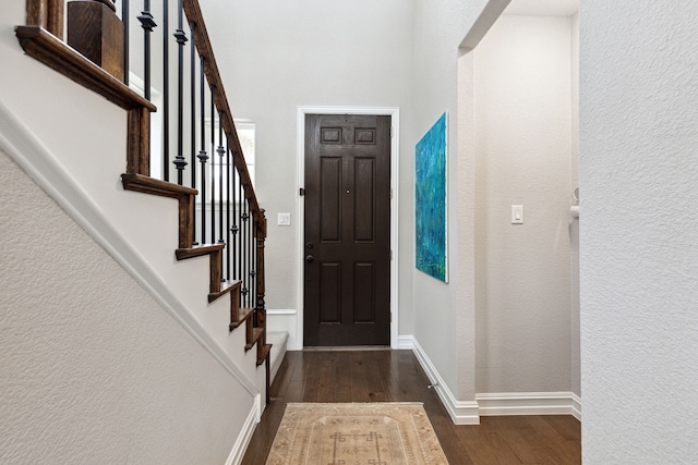 entrance foyer featuring dark hardwood / wood-style flooring