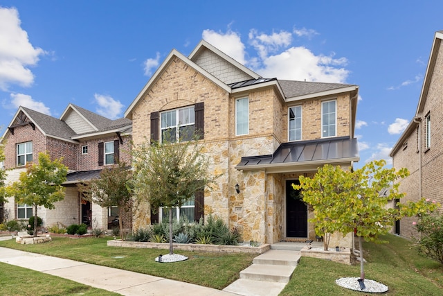 craftsman-style house with a front lawn