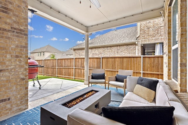 view of patio / terrace featuring an outdoor living space with a fire pit